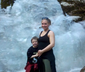 Mom & Kaydin hiking in front of ice wall